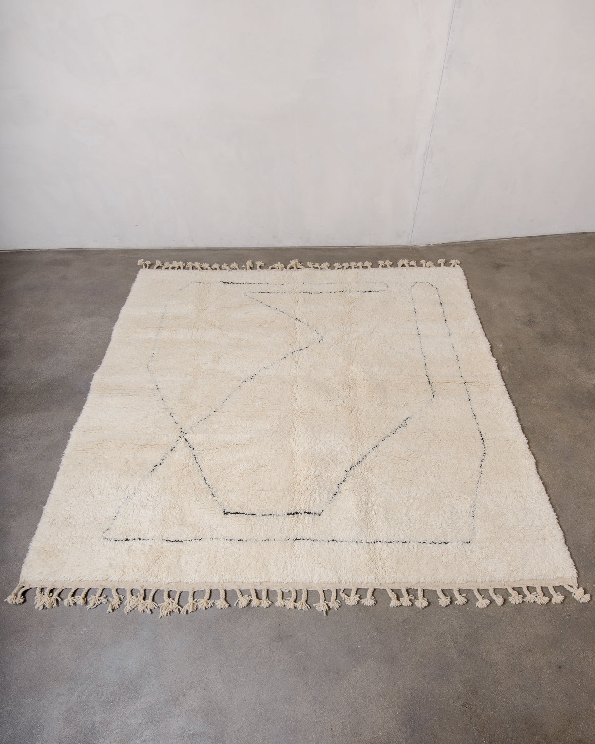 Modern, designer, handcrafted Berber rug from Morocco. Beniourain carpet with minimalist design, natural wool pile and a fluffy texture.